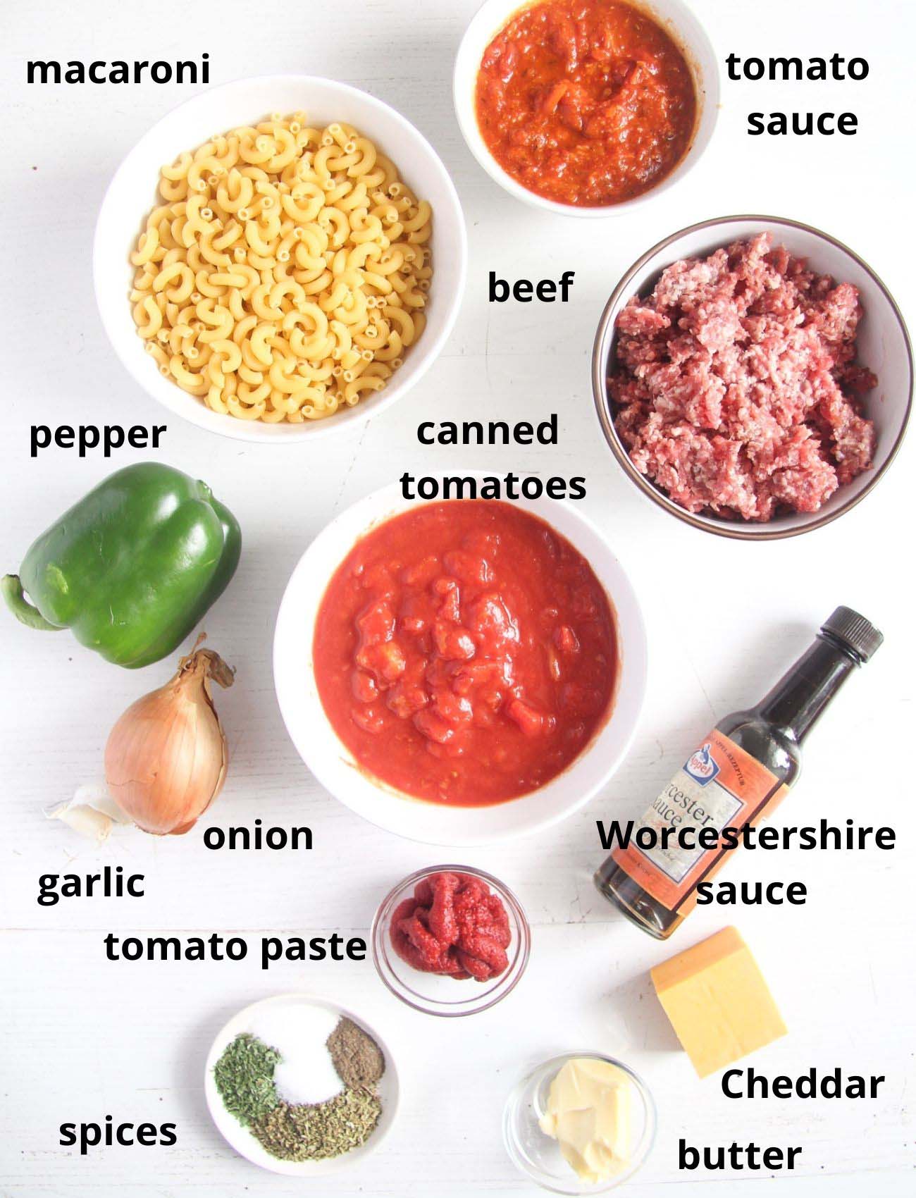 ingredients for pasta with beef arranged on a table.