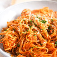 spaghetti with tomato sauce piled in a bowl.