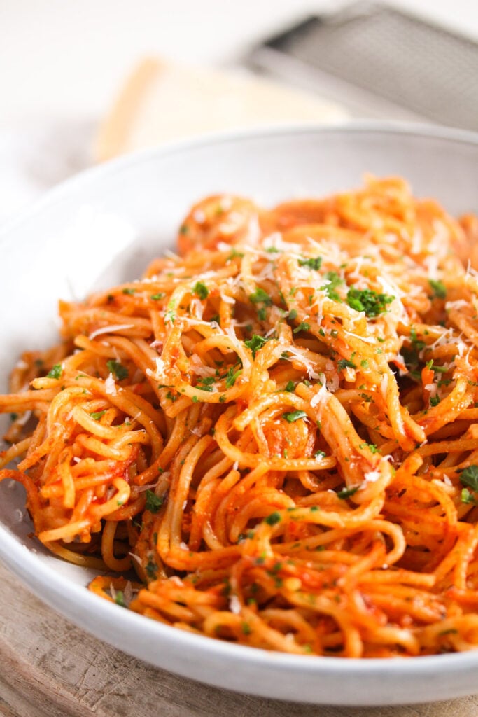 spaghetti with tomato sauce piled in a bowl.