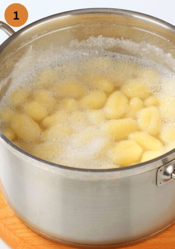 gnocchi cooking in boiling water in a pot.