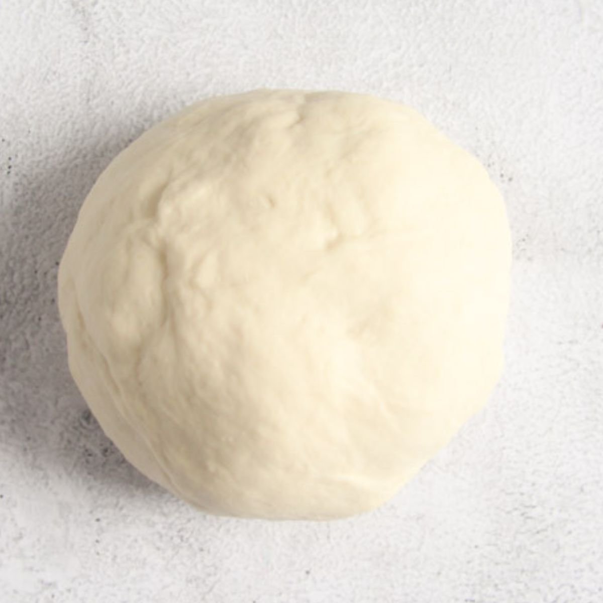 a ball of thermomix pizza dough.