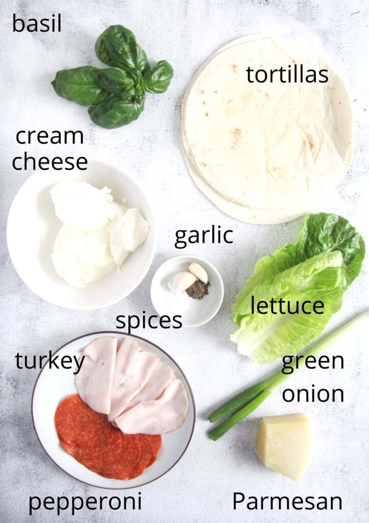 all the ingredients for sandwich pinwheels on the table.