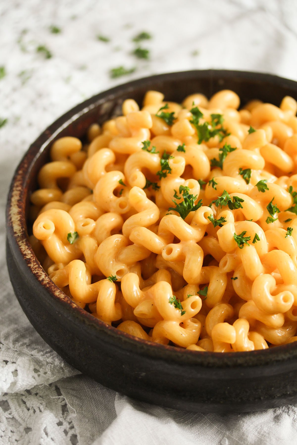 bowl full of golden, cheesy mac made without flour. 