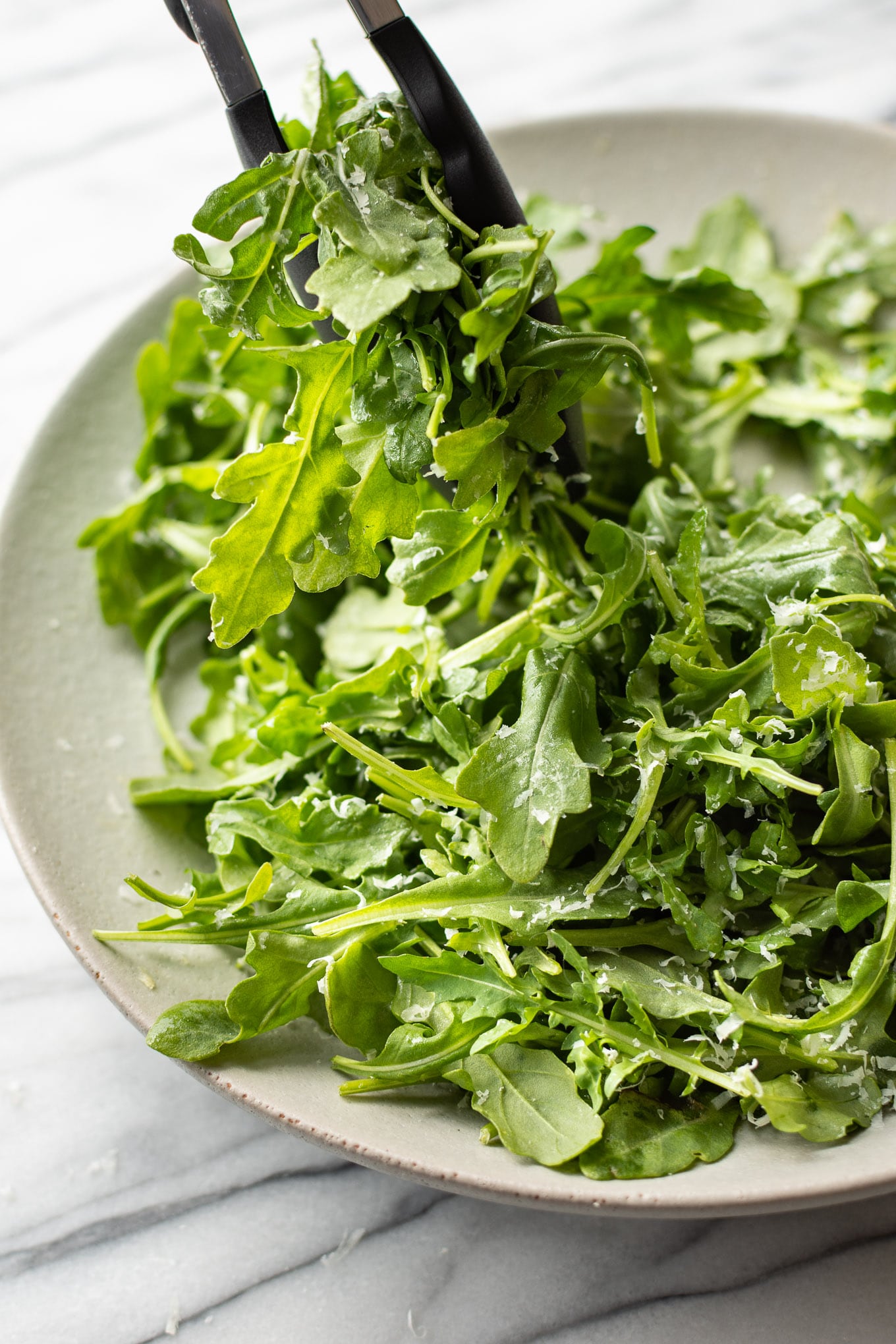 close up image of very quick recipe for arugula salad.