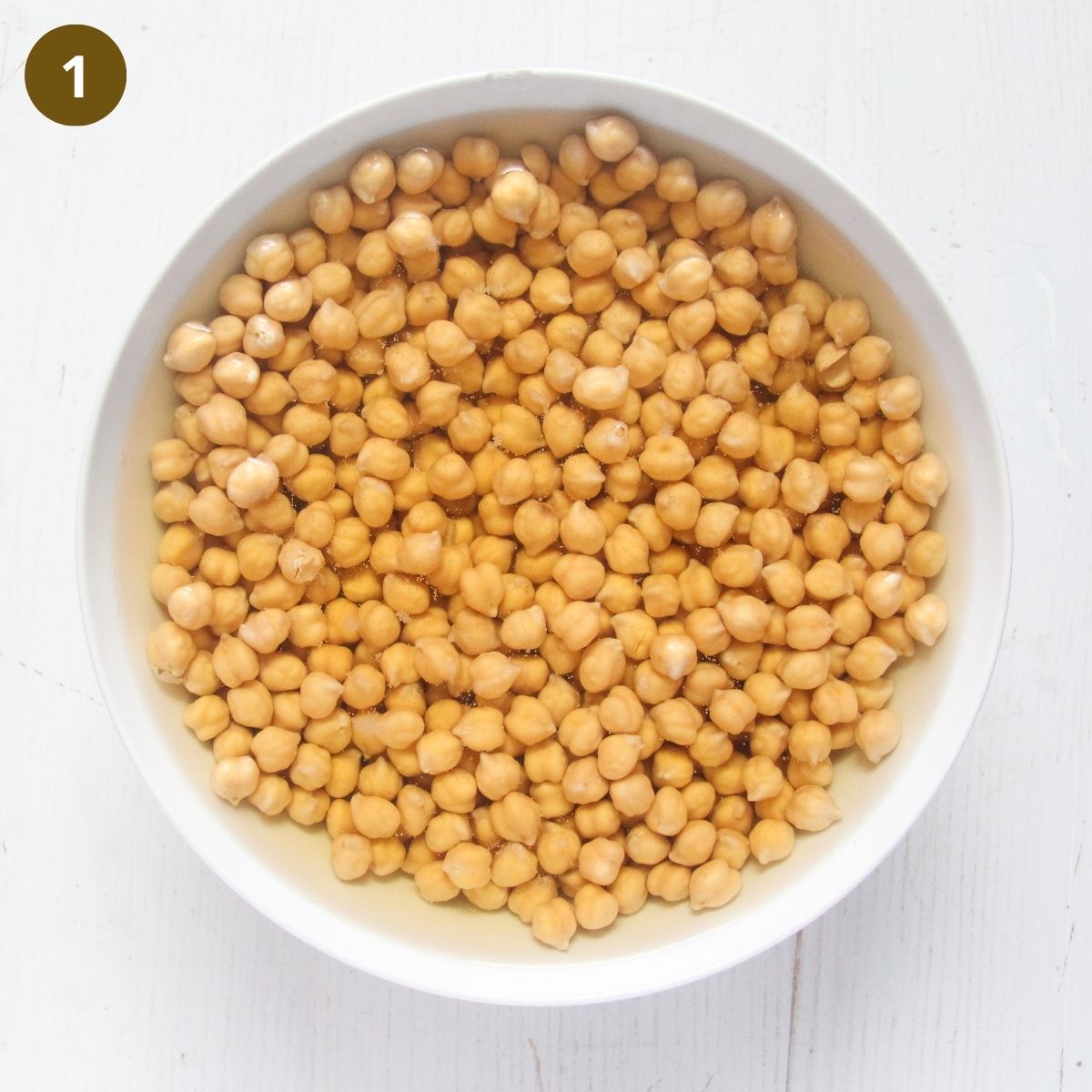 soaking chickpeas in a bowl.