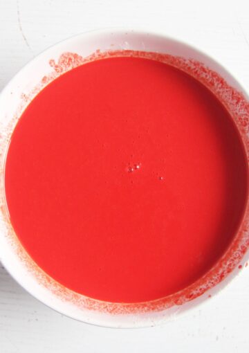 cake batter colored with red food coloring gel.