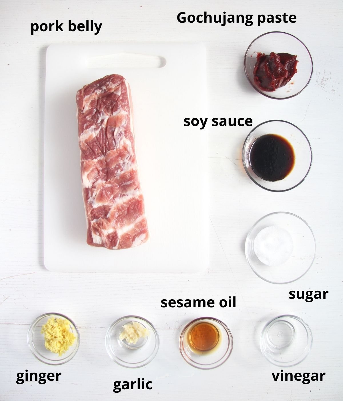 listed ingredients for marinating belly of pork on the table.