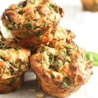 several feta spinach muffins on the table.