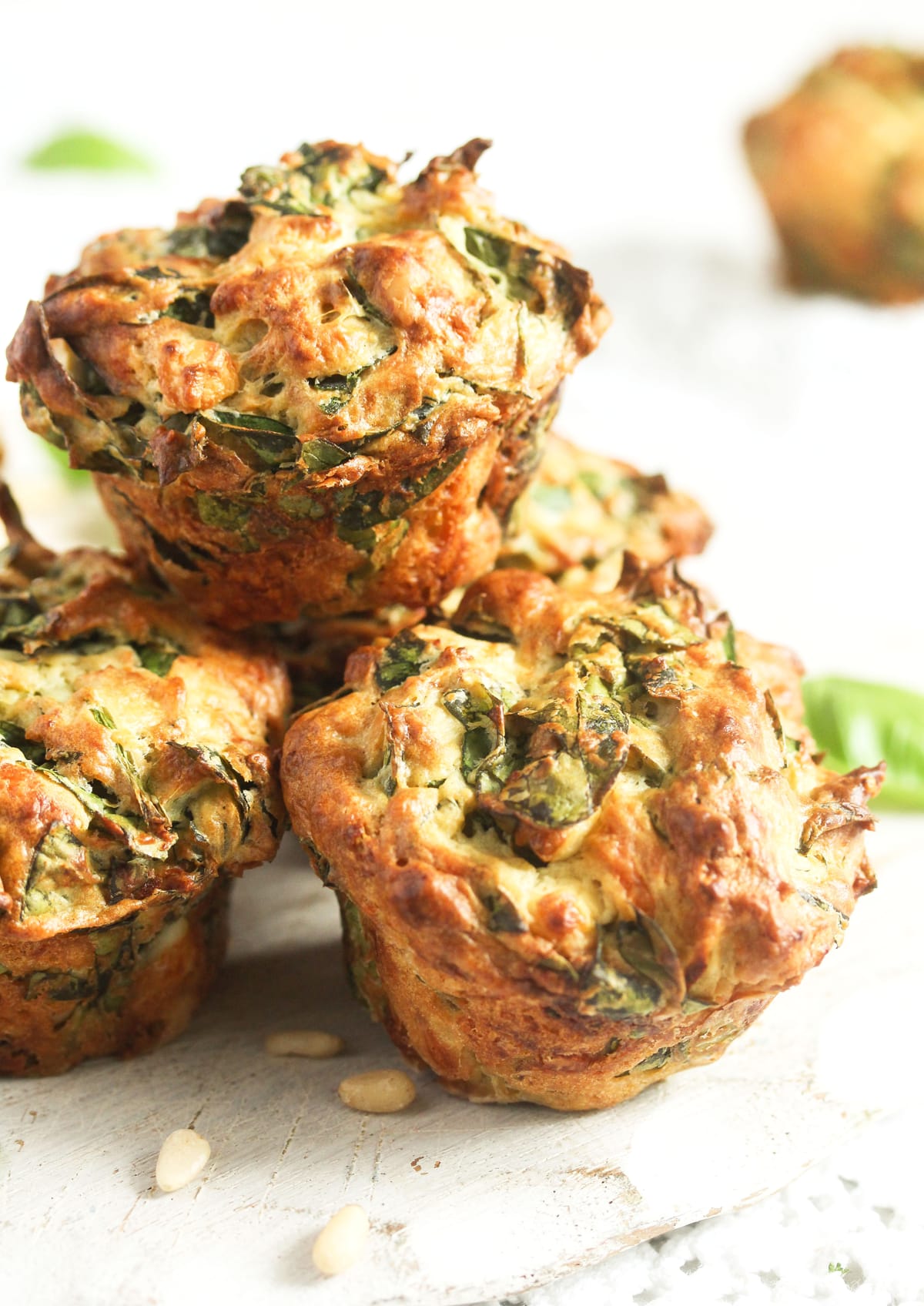 several feta spinach muffins on the table.