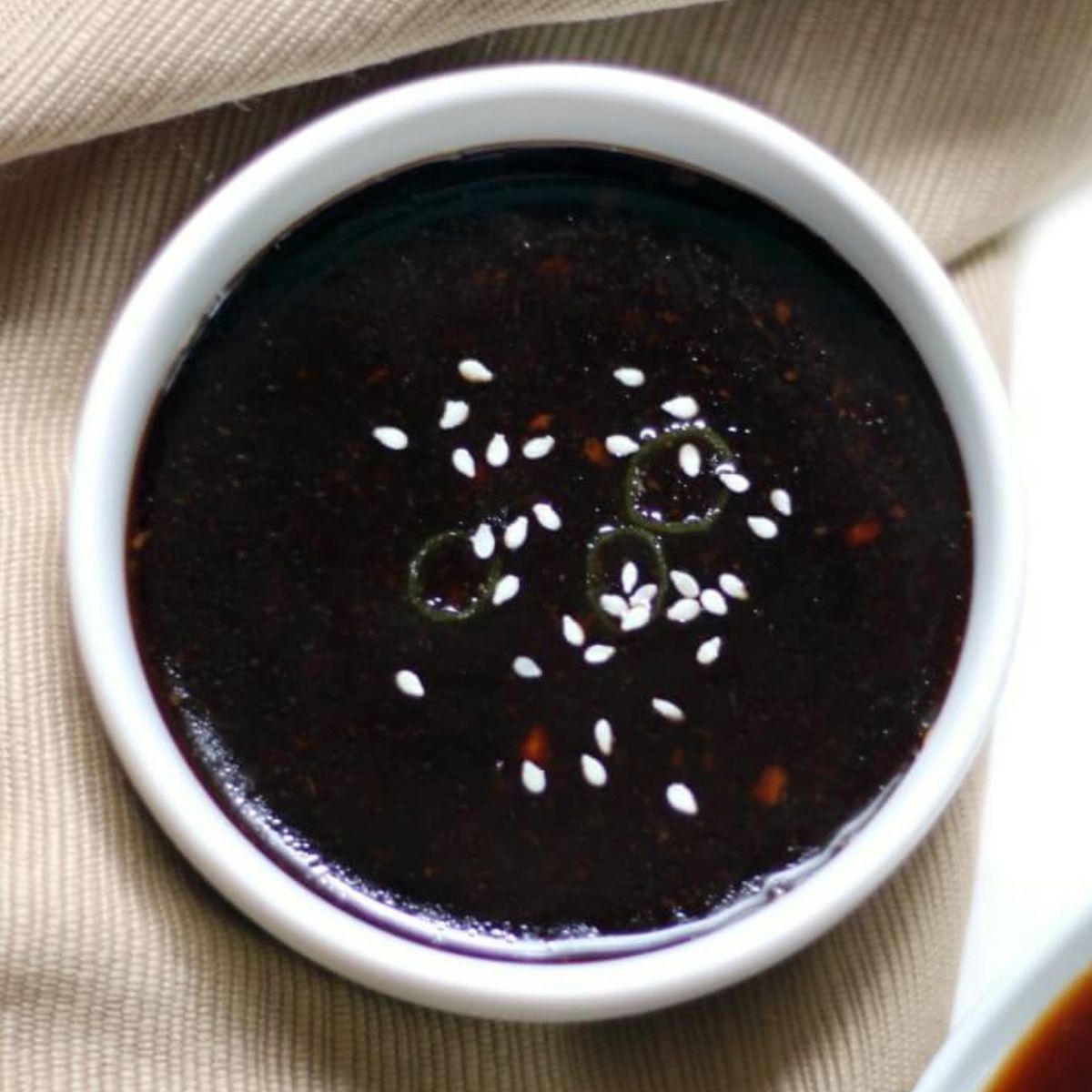 bowl of dark teriyaki sauce.