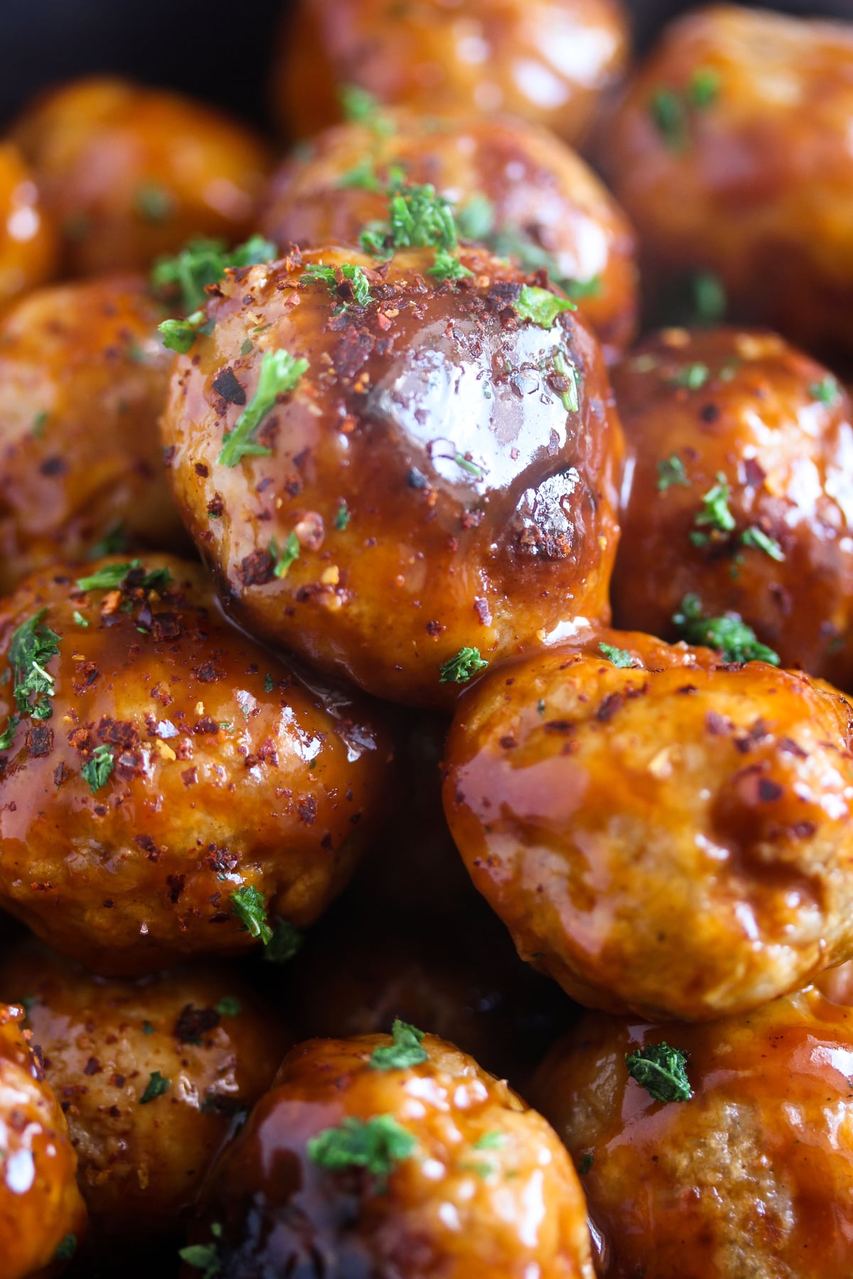 close up sticky and glossy meatballs with ground turkey.