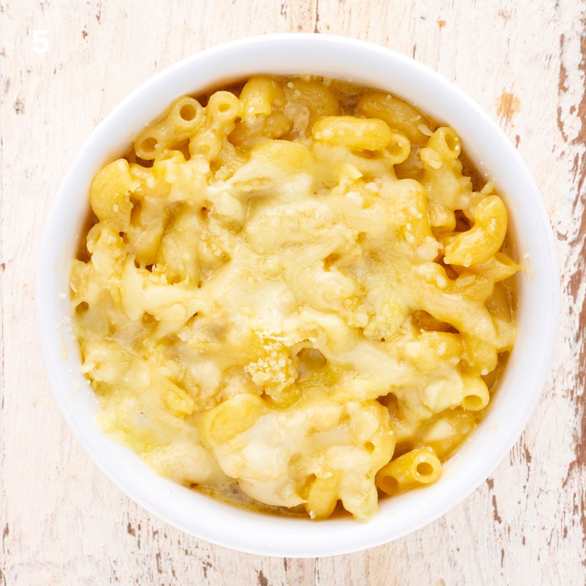 overhead view of copycat chick-fil-a mac and cheese baked in a ramekin bowl.