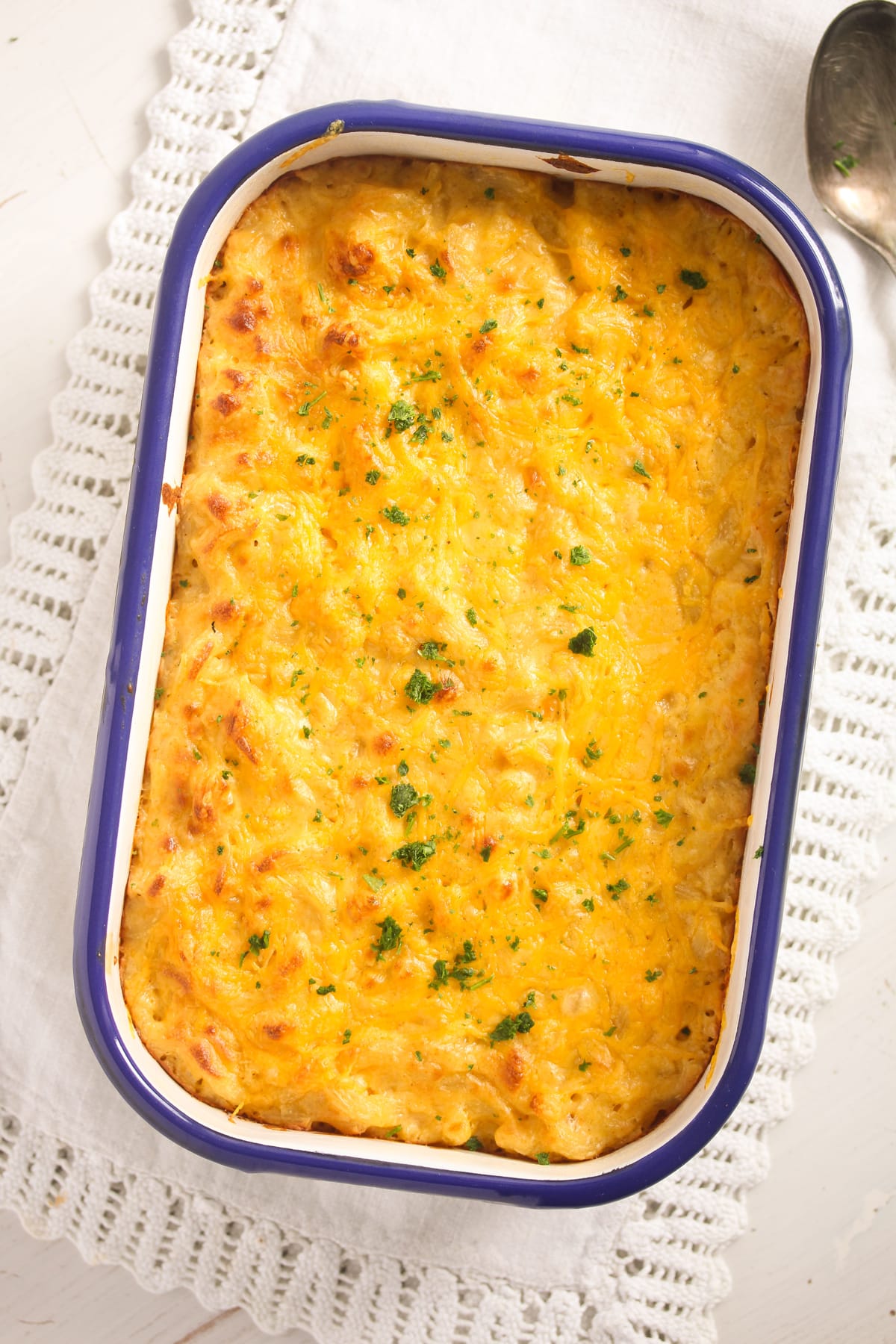 overhead view of a baking dish with baked cheesy mac.
