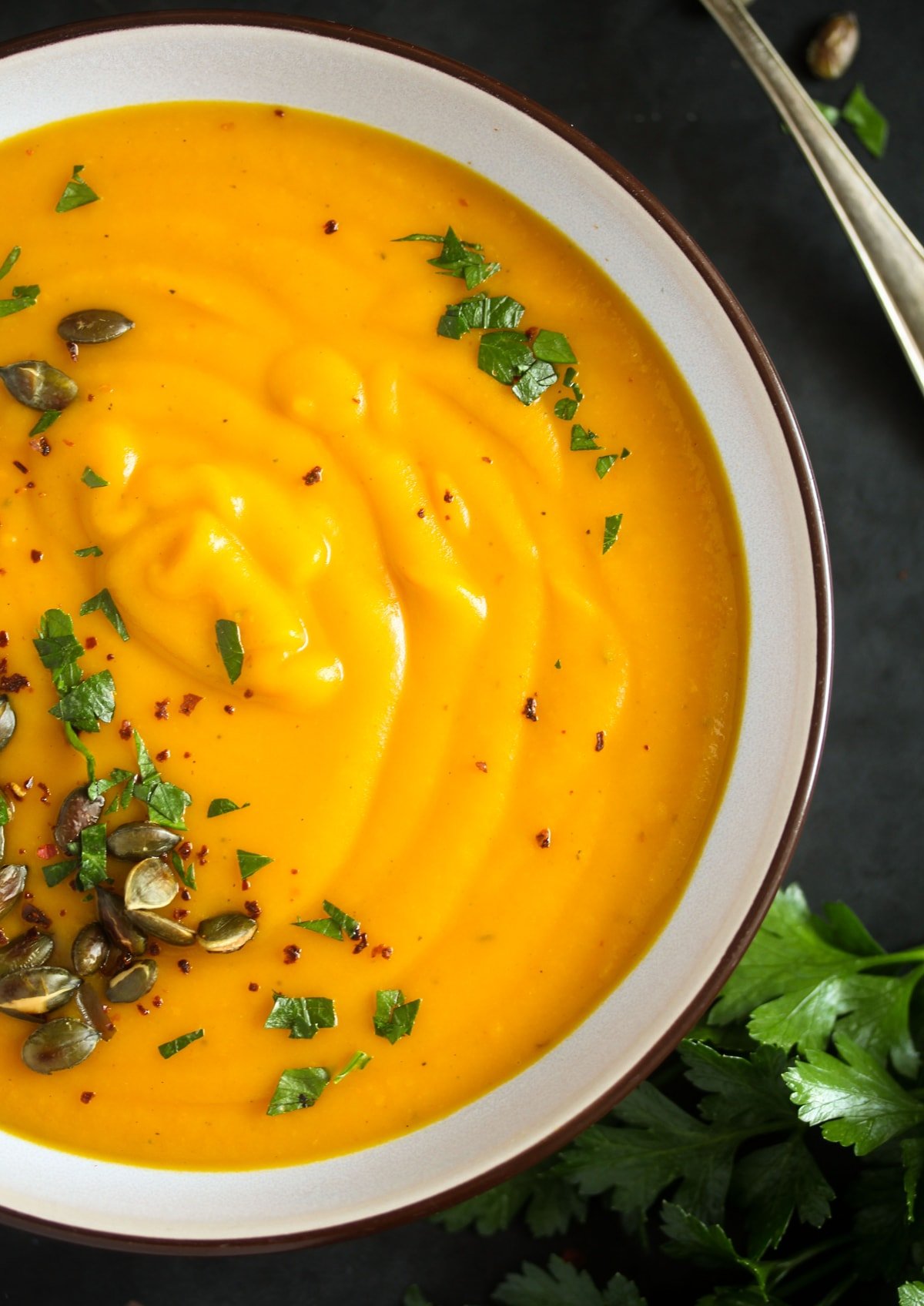 close up creamy pumpkin soup.