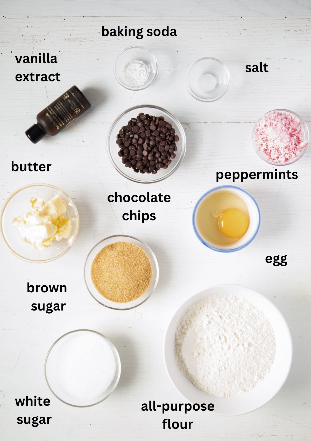 listed ingredients for making cookies with chocolate chips and crushed peppermint.