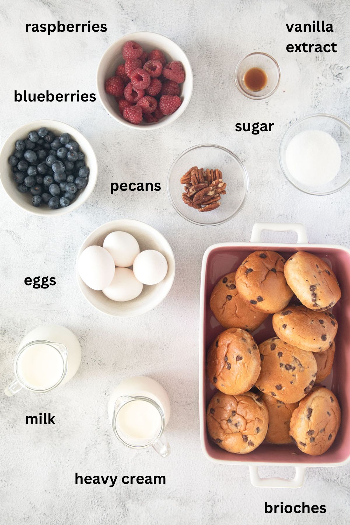 listed ingredients for making baked french toast casserole with brioche and berries.