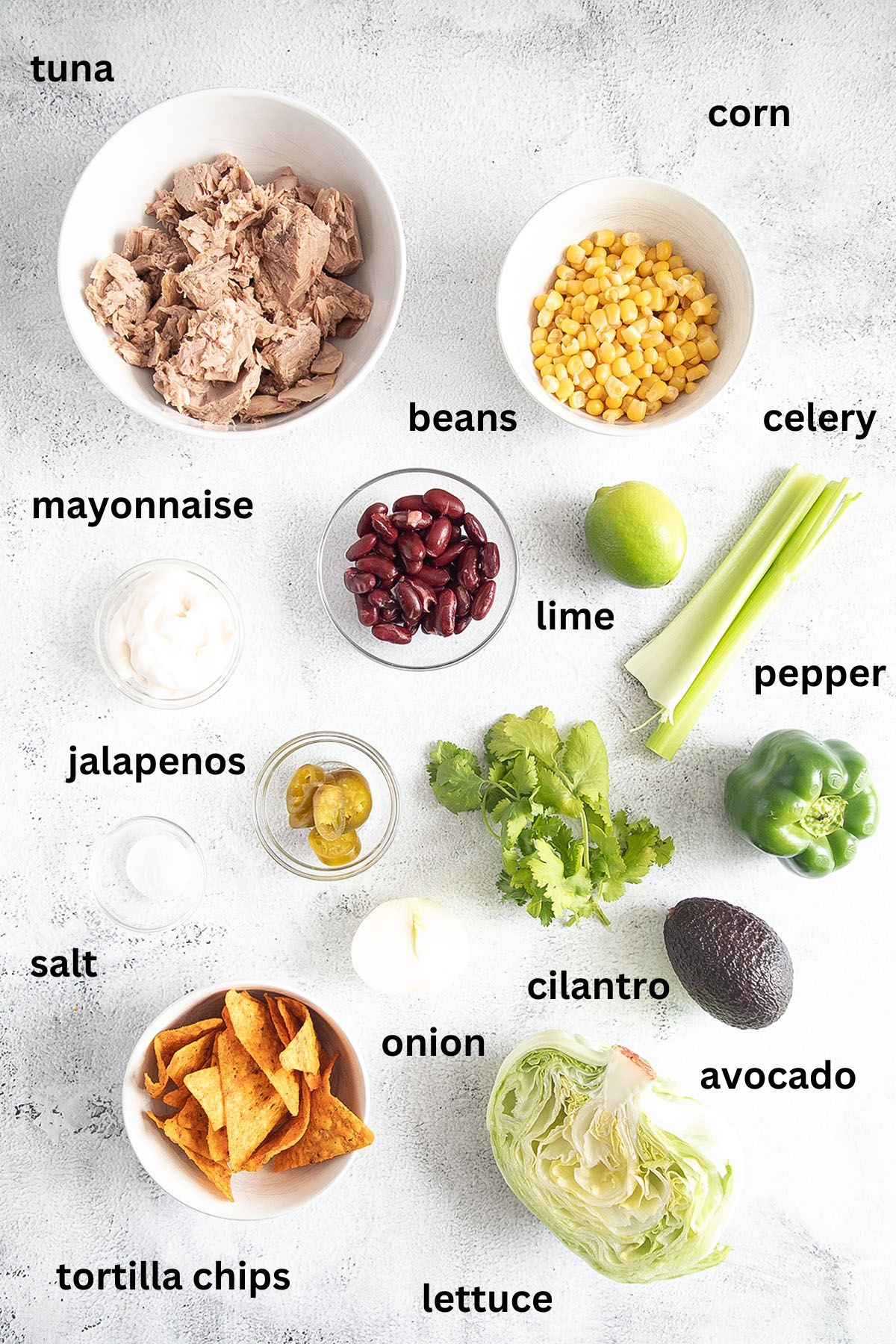 listed ingredients for making tuna salad with corn and beans.