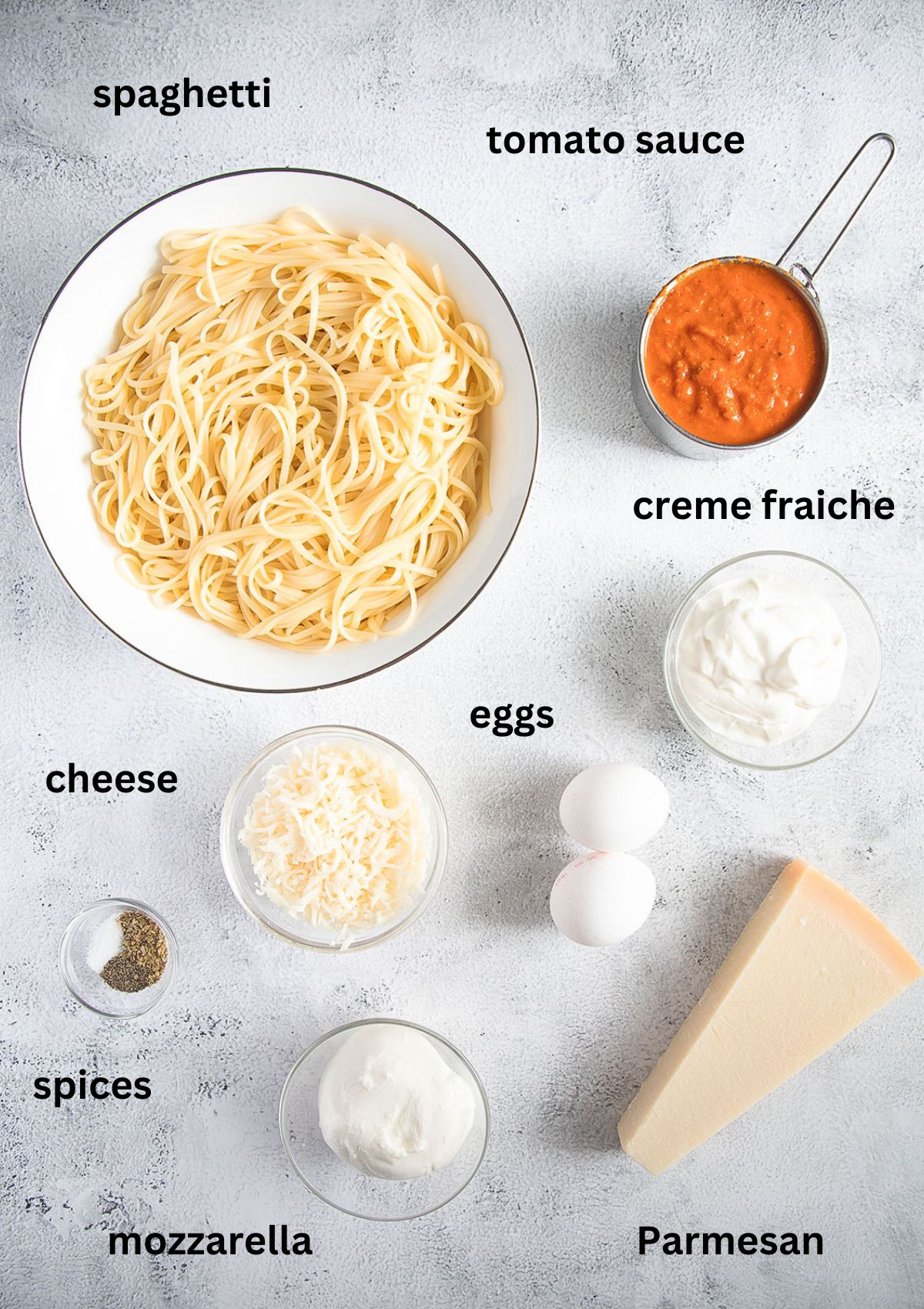listed ingredients for making a casserole with leftover pasta, tomato sauce and three types of cheese.