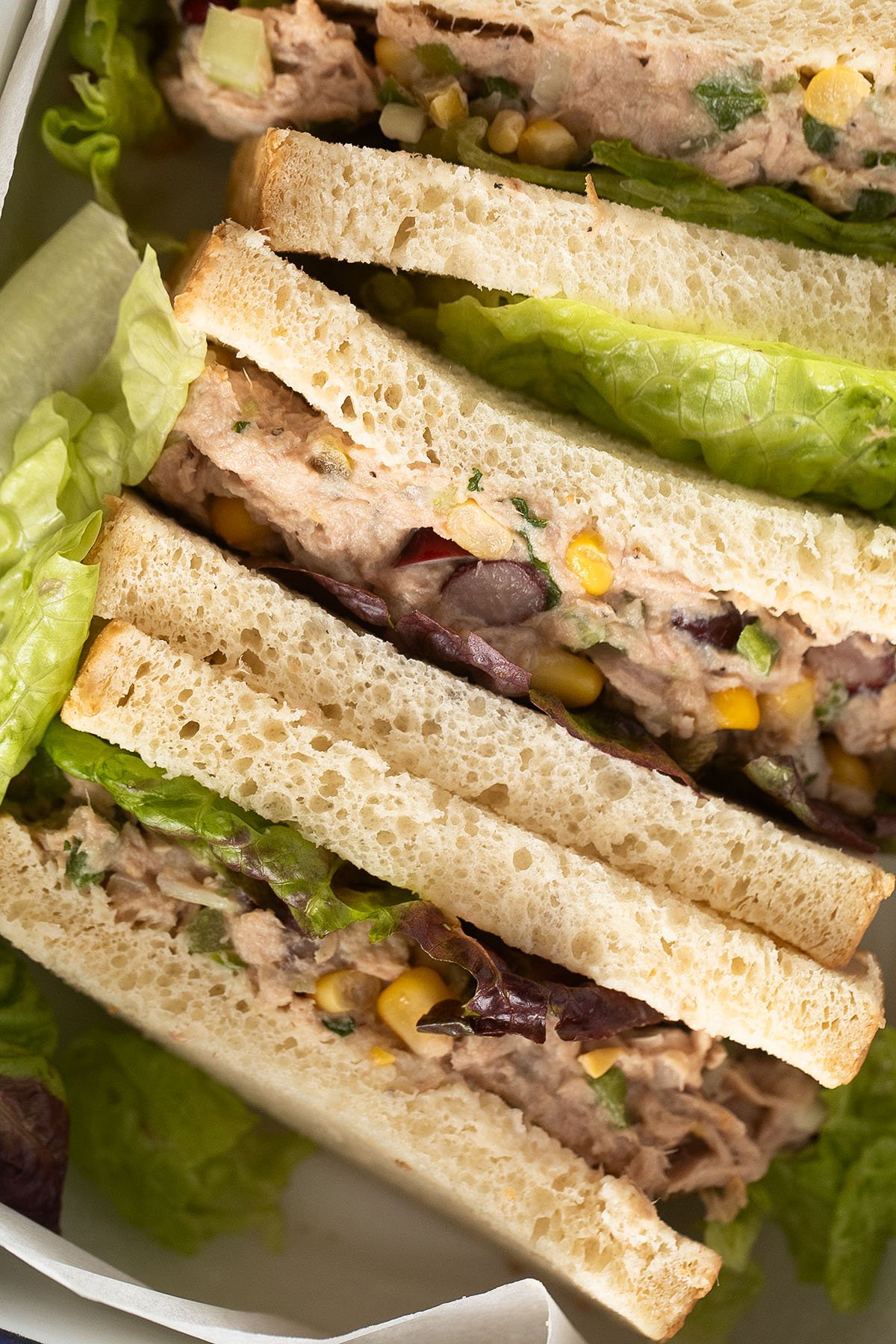 close up of sandwiches made with canned tuna and lettuce.