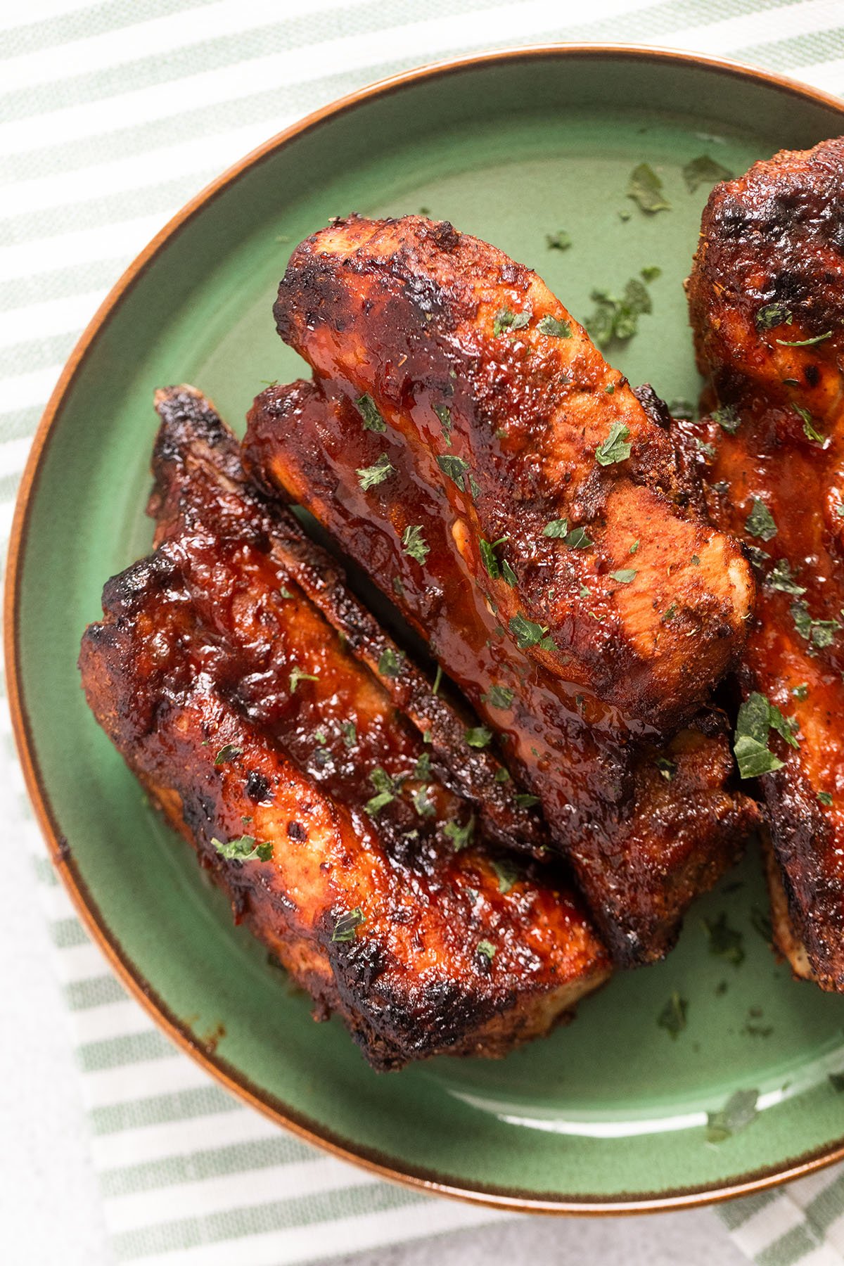 close up glazed bbq country style pork ribs that go well with mac and cheese.