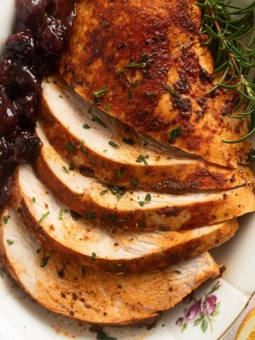 brined boneless turkey breast sliced and served with cranberry sauce.