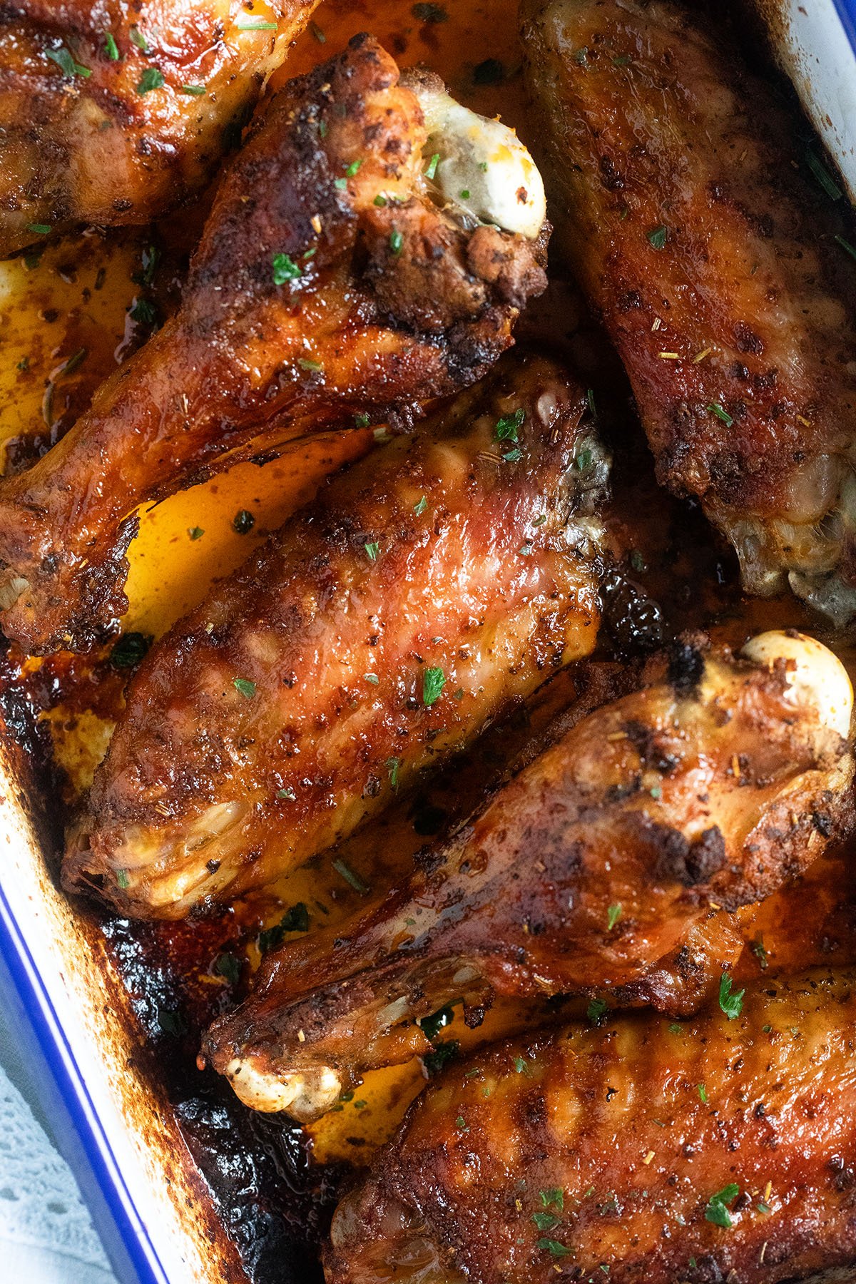 six wings of turkey roasted and sprinkled with parsley.