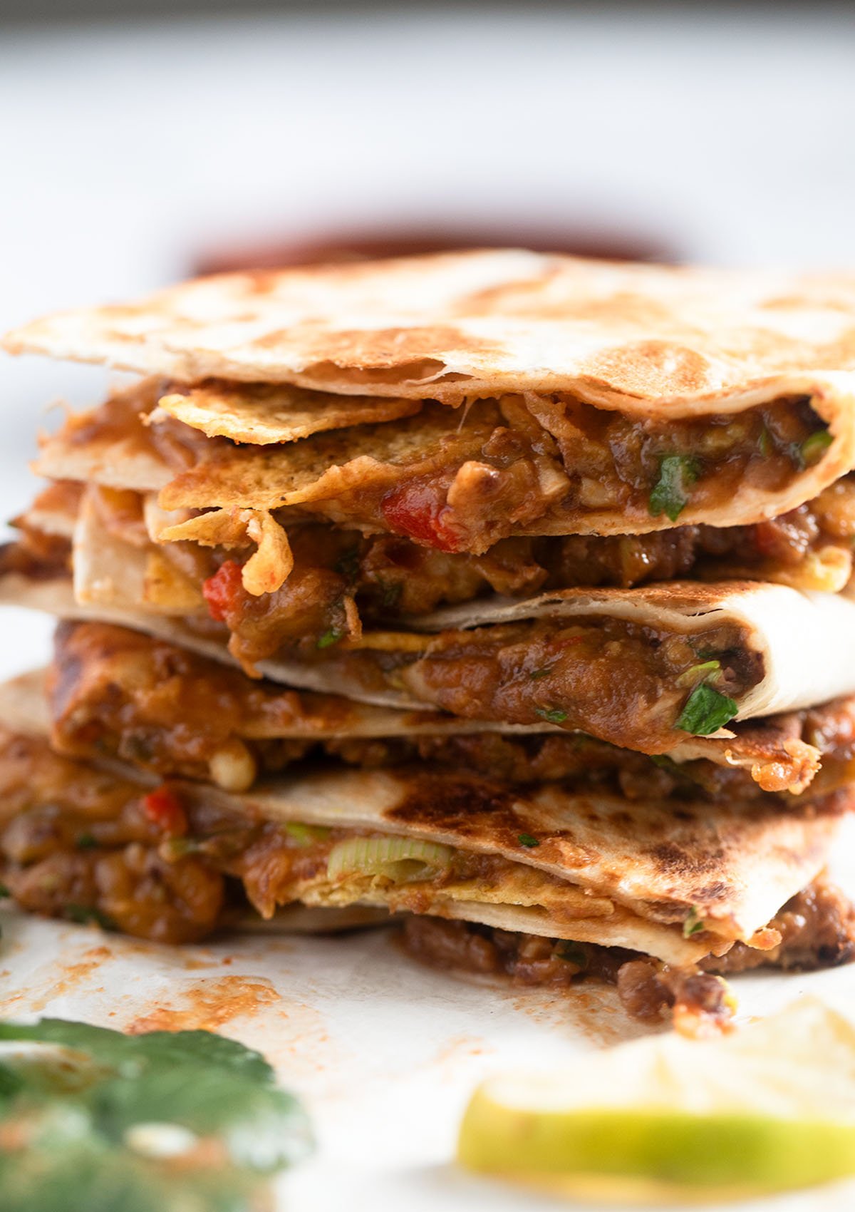 stack of quesadillas with refried beans.