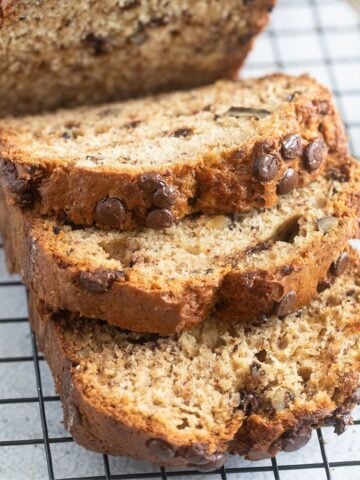 sliced thermomix banana bread on a wire rack.