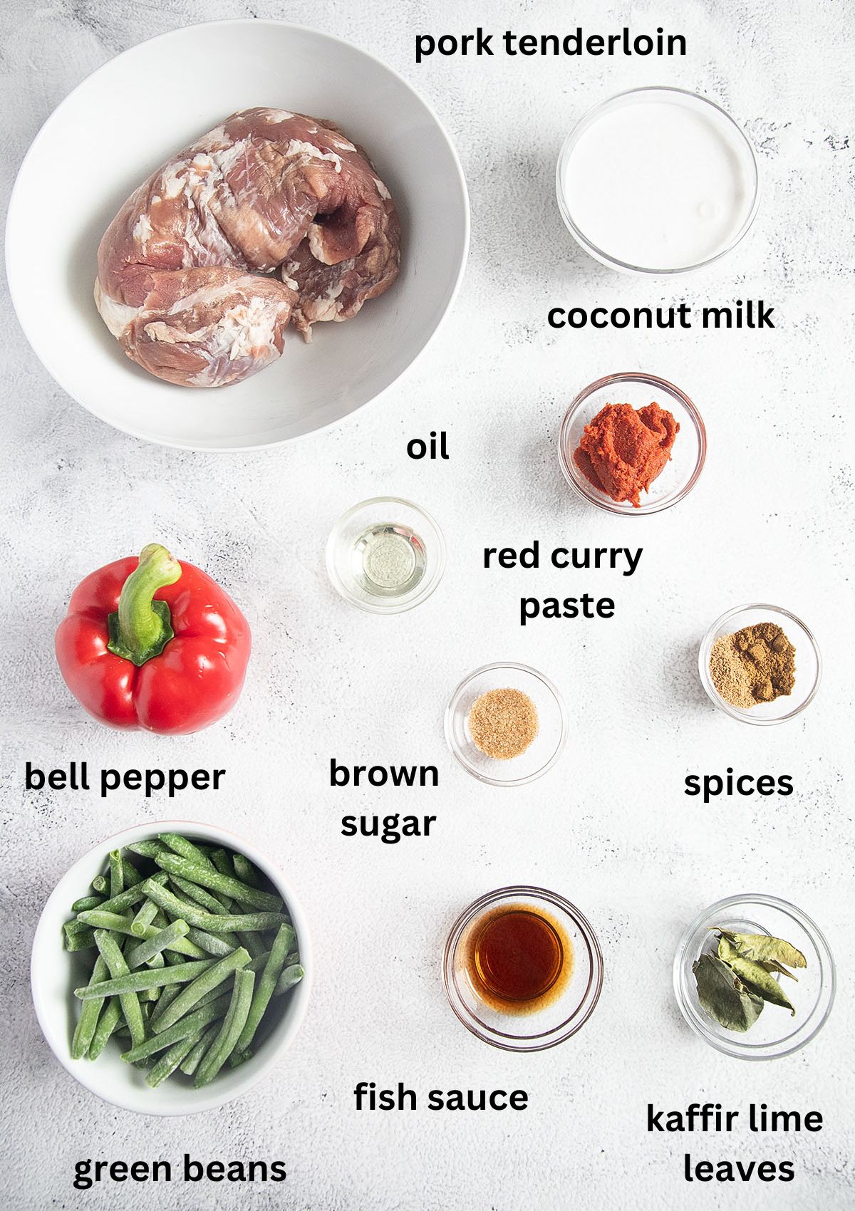 ingredients for making thai curry with pork, coconut milk, and vegetables.