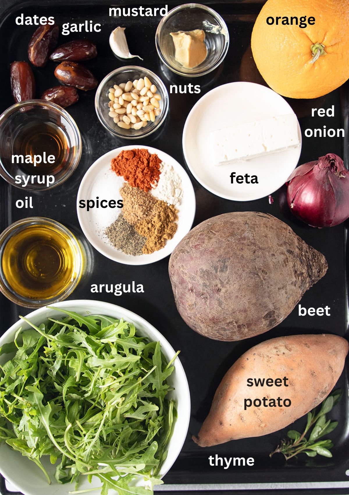 labeled ingredients for making beetroot salad with sweet potatoes, feta, and arugula.