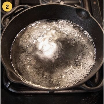 dissolving sugar into water in a cast iron pan.