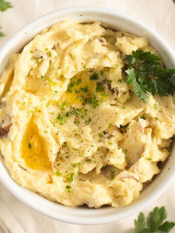 red-skinned mashed potatoes with melting butter on top.