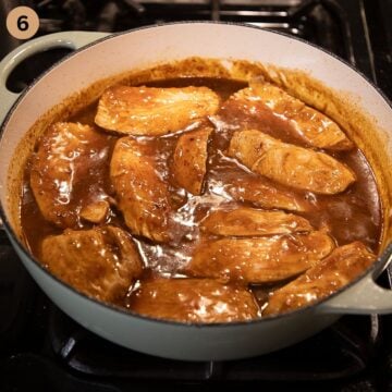 thickly sliced turkey breast simmering in sweet and sour sauce.