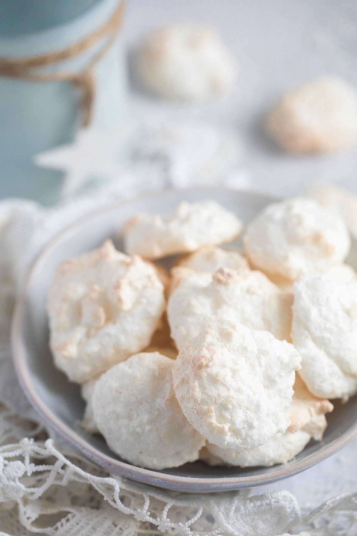 bowl of coconut macaroons, a couple of them behind the bowl.