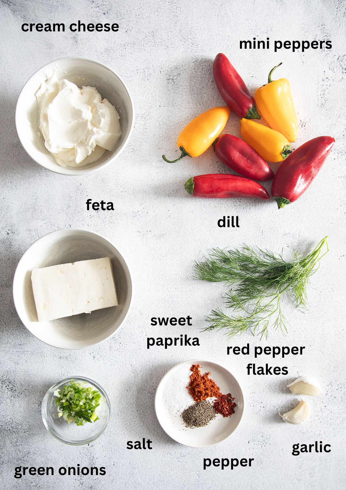 labeled ingredients for making mini peppers stuffed with cream cheese and feta.