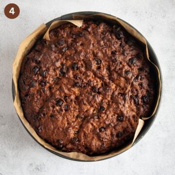 baked fruitcake in a springform lined with parchment paper.