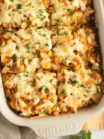 golden cabbage and potato bake in a baking dish.