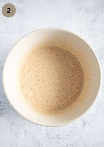 creamed brown sugar and eggs in a bowl for making banana bread.