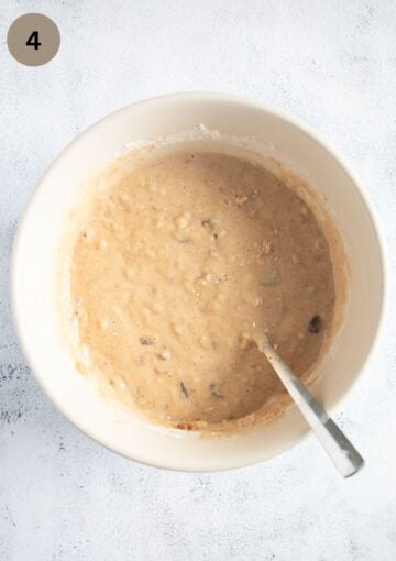 adding raisin and walnuts to banana bread batter.