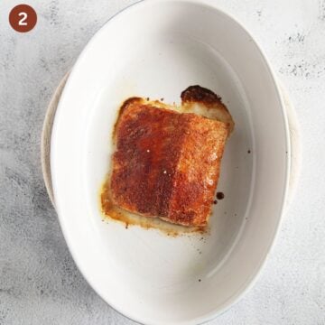 baked salmon fillet in a baking dish.