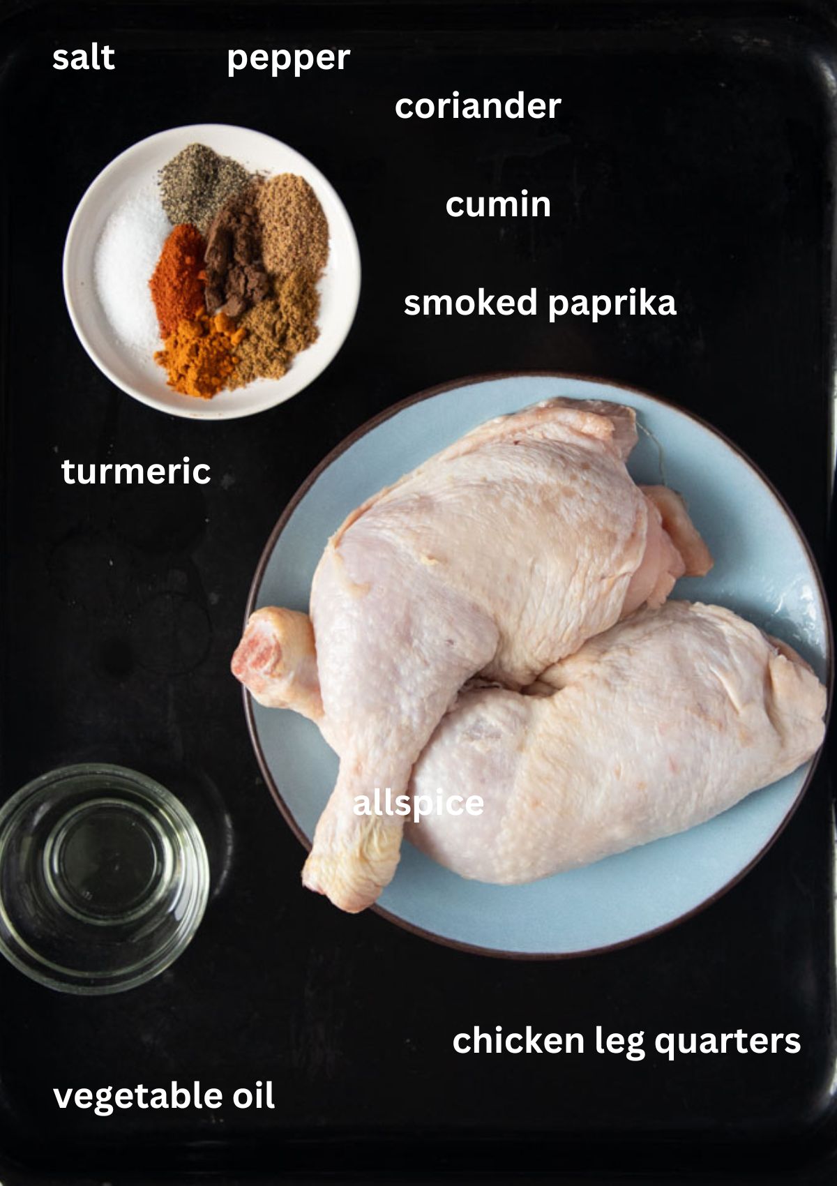 labeled ingredients for cooking chicken quarteres with spices and oil.