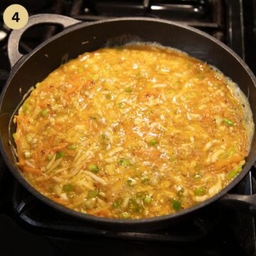 making omelet with cabbage in a large skillet.