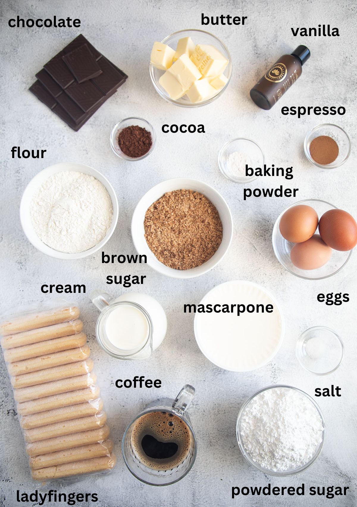 labeled ingredients for making tiramisu brownies with ladyfinger, chocolate, and mascarpone.