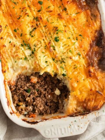 cottage pie with guinness showing the beef filling in a baking dish.