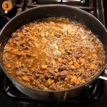 browned ground beef, carrots, and onions cooked in guinness to make cottage pie filling.