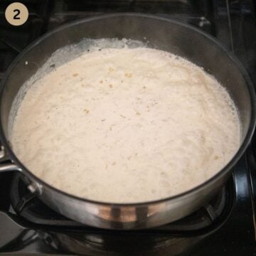 simmering cream sauce for pasta in a large saucepan.