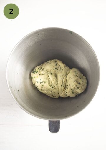 wild garlic bread dough kneaded in the bowl of the food processor.