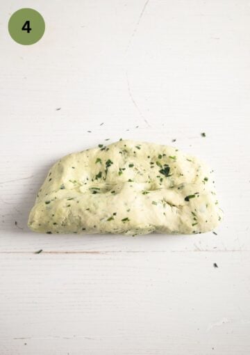 folding dough to shape a loaf of bread.