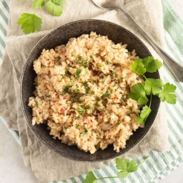 miso brown rice in a small bowl on kitchen cloths.