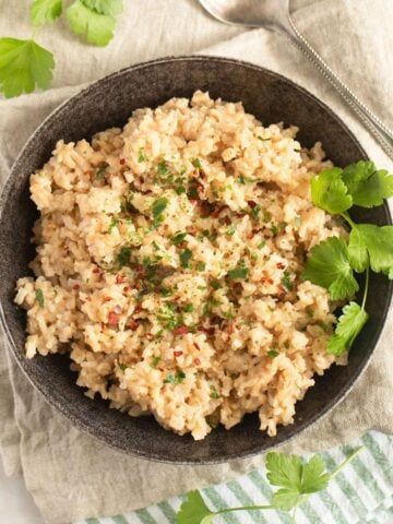 miso brown rice in a small bowl on kitchen cloths.